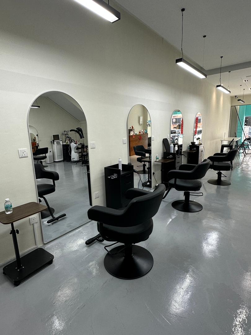 Mirror row and styling chairs inside Untitled Salon