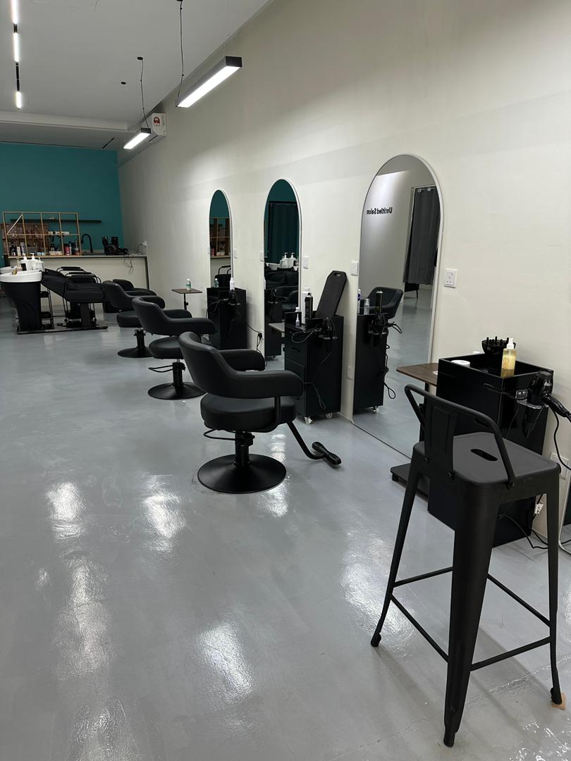 Styling stations and product trolley inside Untitled Salon
